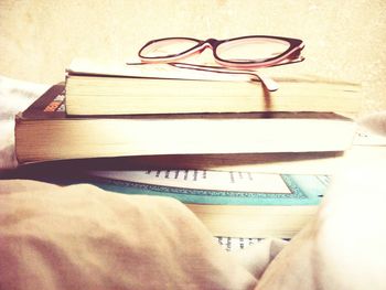 Close-up of eyeglasses on book