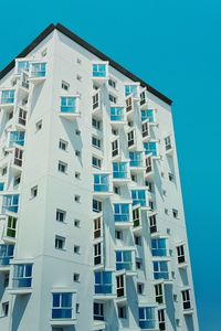 Low angle view of building against clear blue sky