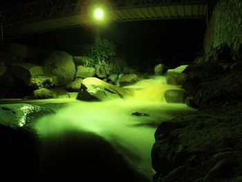 Illuminated water at night