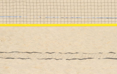 Close-up of green net on beach