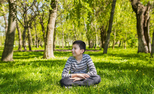 Boy day dreaming outdoors