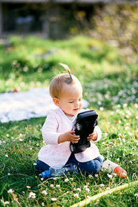 Full length of cute baby girl on field