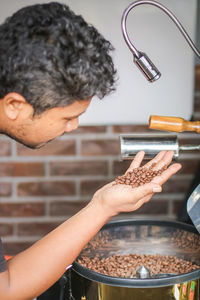 Midsection of man preparing food in kitchen