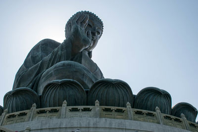 Low angle view of statue against sky