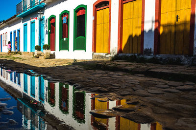 Row of multi colored buildings in city
