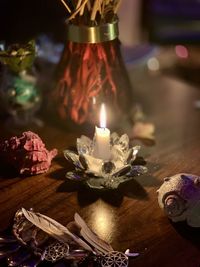 Close-up of illuminated candles on table