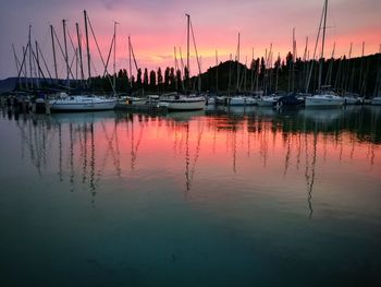 Sailboats in lake at sunset