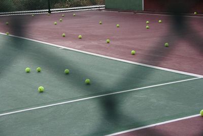 High angle view of balls on tennis field