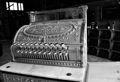 Close-up of old machine on table