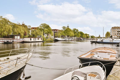 Boats moored at harbor