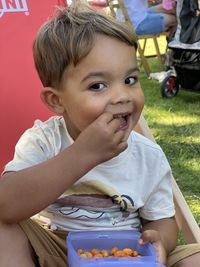 Portrait of cute boy eating food