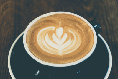 Close-up of cappuccino on table