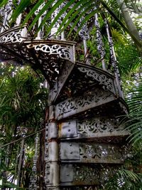 Low angle view of built structure against trees