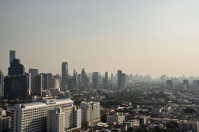 High angle view of modern buildings in city against sky