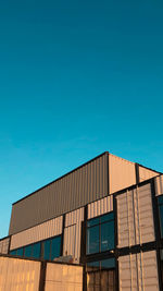 Low angle view of building against clear blue sky