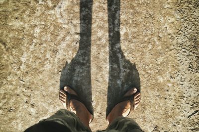 Low section of person standing on ground