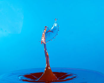 Close up of water drop on blue background