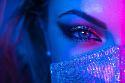 Close-up of illuminated woman face with make up