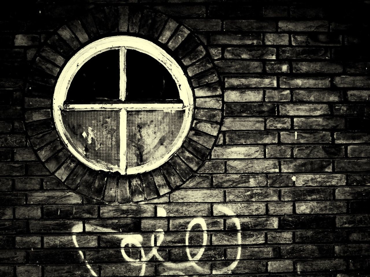 brick wall, circle, built structure, architecture, wall - building feature, building exterior, arch, geometric shape, wall, brick, no people, outdoors, window, old, text, stone wall, day, weathered, close-up, pattern