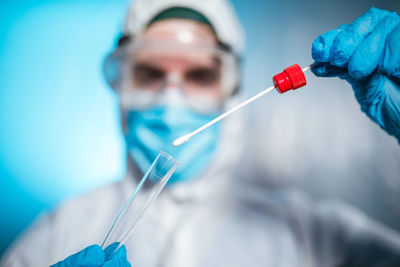 Close up of nurse with coronavirus swab. selective focus on the pad