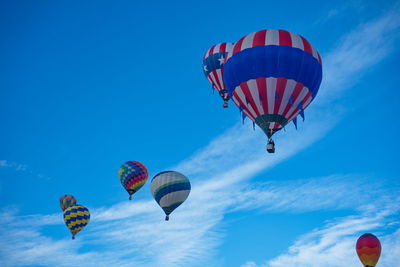 Low angle view of hot air balloons against clear sky