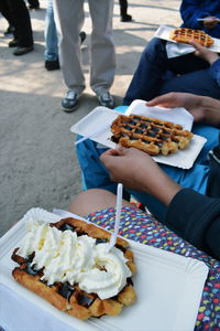 Low section of man eating food