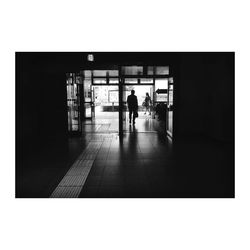 Woman standing by railing