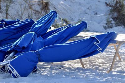 Deck chairs on snow covered field