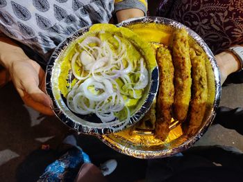 High angle view of people holding food