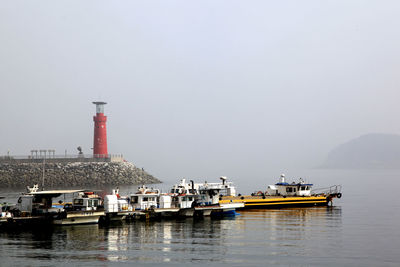 Boats moored in river