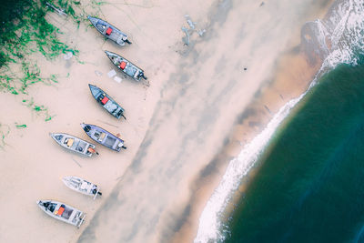 High angle view of motor boats at beach