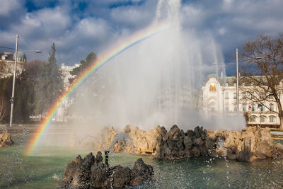 View of the beautiful buildings at vienna city center and the fountain at schwarzenbergplatz