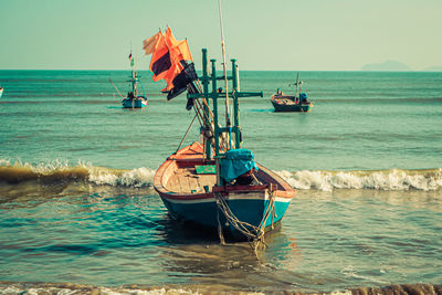 Old wooden boats at the beach andaman sea, thailand 