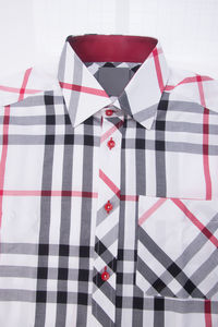 Close-up of shirt over white background