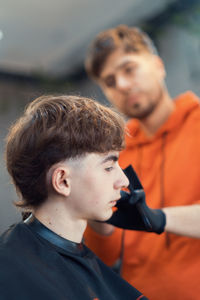 Barber teenager haircut