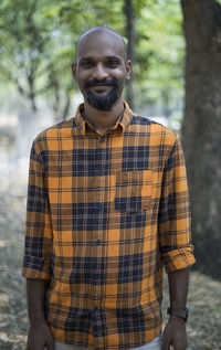 Portrait of young man standing outdoors