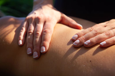 Close-up of people on hands