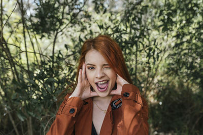 Portrait of a smiling young woman outdoors