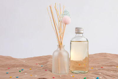 High angle view of bottles against white background