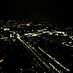 High angle view of illuminated buildings in city at night