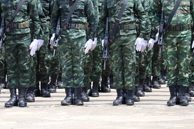 Low section of soldiers standing on street