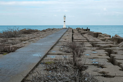Road and breakwater leading to the lighthouse