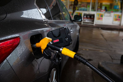 The car is refueling at the gas station.