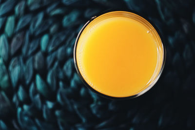 High angle view of orange juice