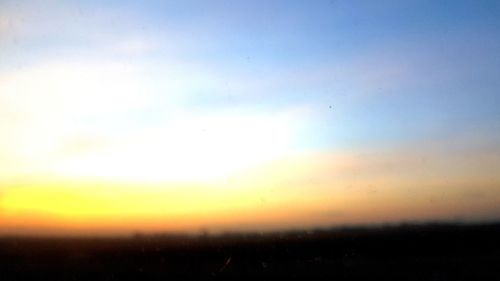 Scenic view of landscape against sky during sunset