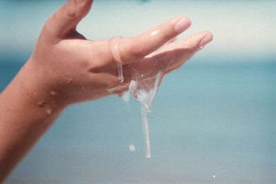Close-up of woman hand holding water