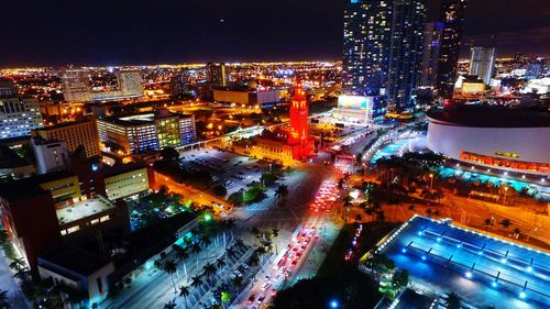 Aerial view of city lit up at night