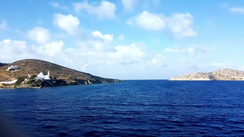 Scenic view of sea against cloudy sky