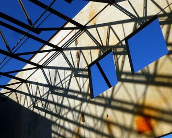Low angle view of skylight against blue sky