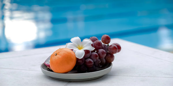 Close-up of fresh fruits in bowl on table